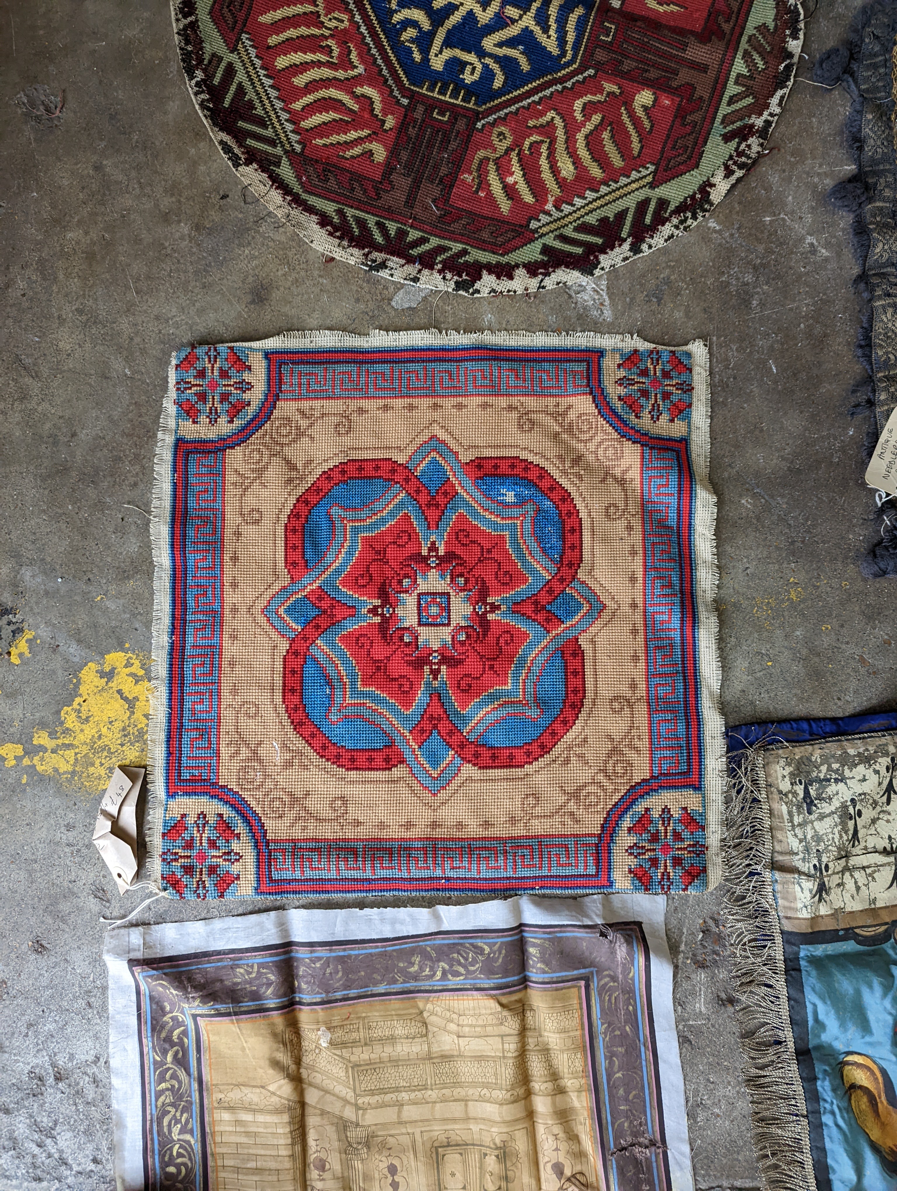 An Ottoman silk Koran cloth, three needle and bead work covers and assorted textiles